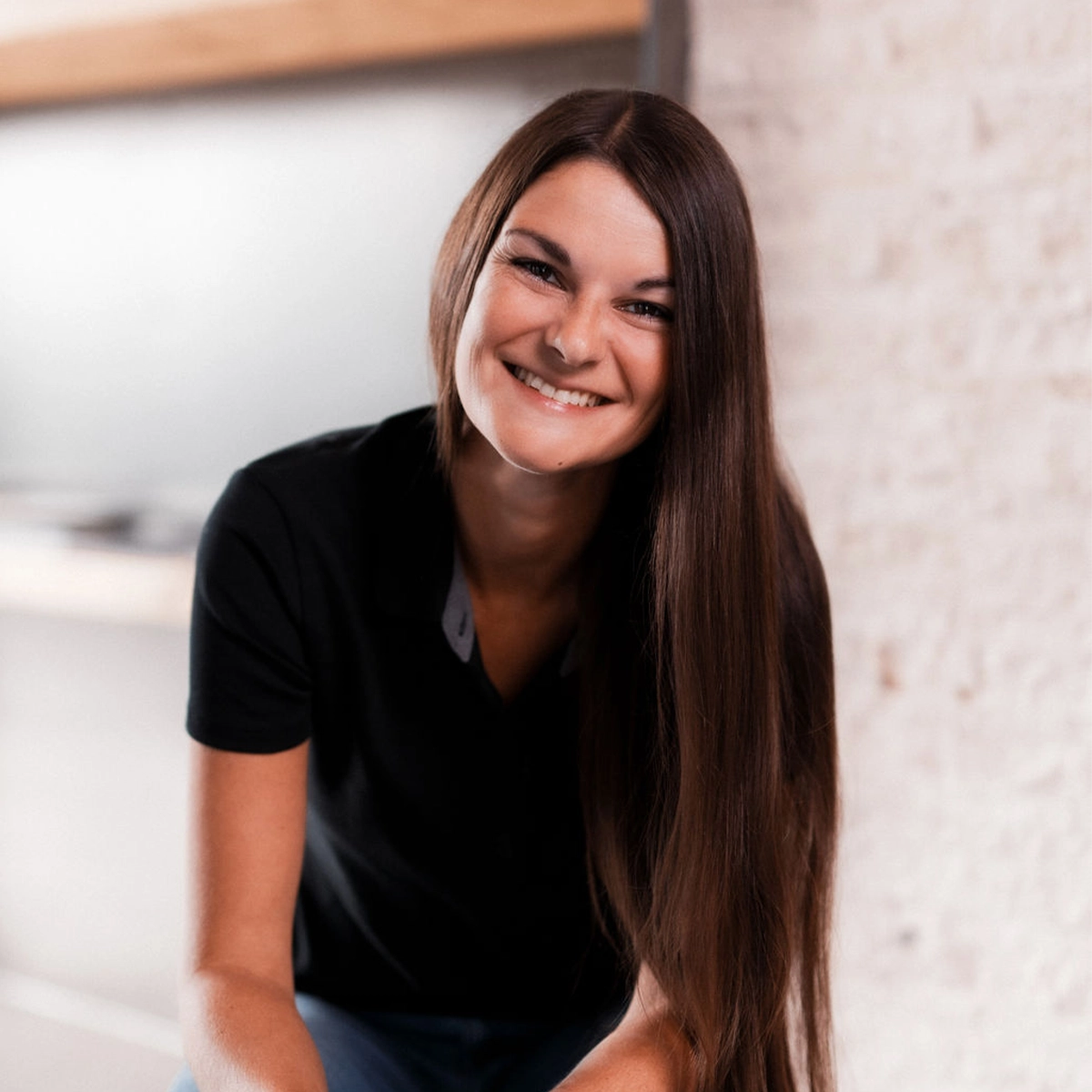 Madeleine lächelt in die Kamera.